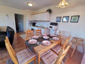 a dining room and kitchen with a table and chairs at Strandbad in Horumersiel
