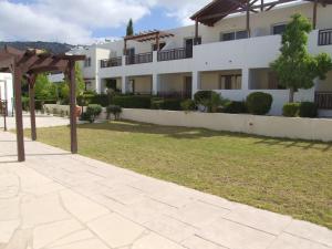 a view of a building from the garden at Pleasant Studio apartment, Z4 in Vanessa Complex in Peyia