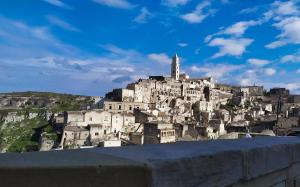 a town on top of a mountain at Loggia delle stelle in Matera