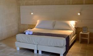 A bed or beds in a room at Loggia delle stelle