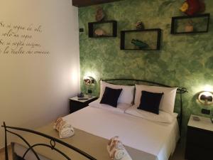 Łóżko lub łóżka w pokoju w obiekcie B&B Medusa House Gallipoli