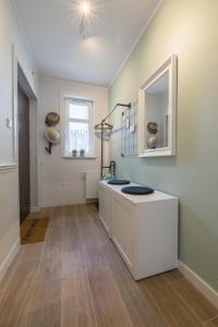 a kitchen with a counter and a sink and a window at Stay in Ustka in Ustka