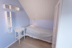 Postel nebo postele na pokoji v ubytování Raaehuset