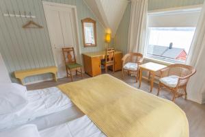 En eller flere senge i et værelse på Raaehuset