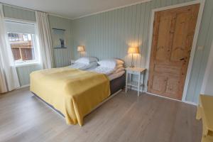 En eller flere senge i et værelse på Raaehuset + 6 billeder