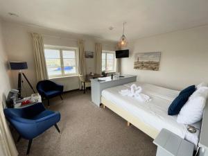 Postel nebo postele na pokoji v ubytování Havenhotel At Sea Texel