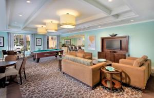 a living room with couches and a pool table at WorldMark San Diego – Mission Valley in San Diego