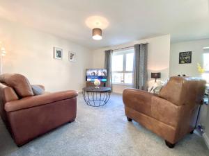 Μια τηλεόραση ή/και κέντρο ψυχαγωγίας στο Serviced Accommodation Moray Holyrood