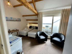 Postel nebo postele na pokoji v ubytování Havenhotel At Sea Texel