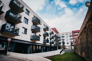 a building with balconies on the side of it at AH Mlynská Bašta I in Košice