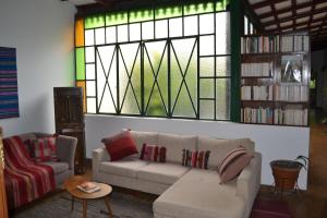 a living room with a couch and a stained glass window at Casona Leguizamon in Salta