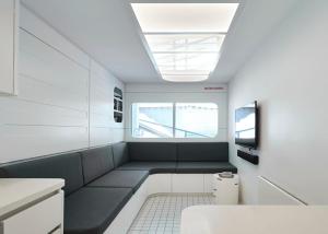 a small room with a bench and a window at Hub 14 in Falls Creek