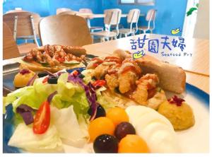 a plate of food with food on a table at Shang Yuan in Green Island