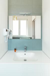 a bathroom with a sink and a mirror at FeMa B&B - Housea in Polignano a Mare