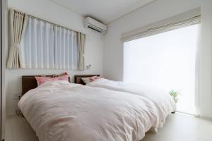 Кровать или кровати в номере Ferie Nara