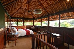 Postel nebo postele na pokoji v ubytování Bebek Cottages Sanur