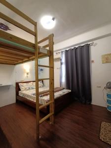 Postel nebo postele na pokoji v ubytování Ludao B&B