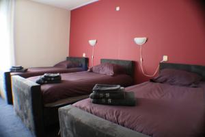 เตียงในห้องที่ Hotel de Harmonie