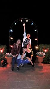 a group of people sitting under an arch at night at Penzión Pod orechom in Turčianske Teplice +83 photos
