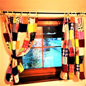 a window with a view of a snow covered yard at Penzión Pod orechom in Turčianske Teplice