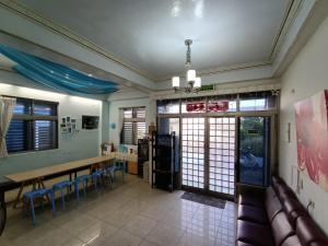 a dining room with a table and chairs at Ludao B&B in Green Island