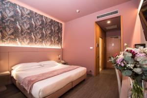 Letto o letti in una camera di Hotel Ristorante Ala d'Oro