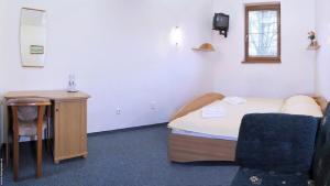 Ein Bett oder Betten in einem Zimmer der Unterkunft Penzión DRUŽBA Bojnice