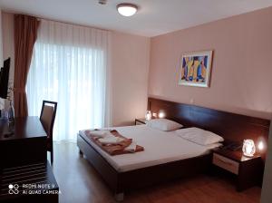 Postel nebo postele na pokoji v ubytování Hotel Orka