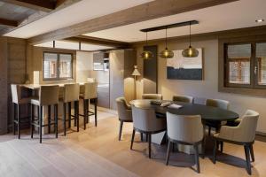 a kitchen and dining room with a table and chairs at Six Senses Residences & Spa Courchevel in Courchevel