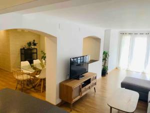 a living room with a flat screen tv and a couch at Puerto Banus in Marbella