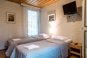 Postel nebo postele na pokoji v ubytování Ministudio - Apartments Joensuu