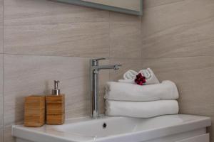 a bathroom with towels sitting on the tub at APARTMENTS BAKA in Selca +51 photos