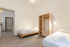 Castelli's Apartment for your holiday 12 tesisinde bir odada yatak veya yataklar
