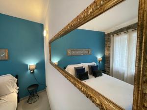 Posteľ alebo postele v izbe v ubytovaní L'EMPORIO ROOMS