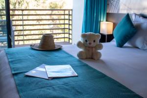 Postel nebo postele na pokoji v ubytování Hôtel Souani ( Al Hoceima Bay)