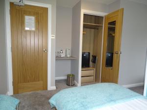 A bed or beds in a room at Pen Mar Guest House 