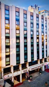 a large white building with a hotel at Prestige Hotel Old City in Istanbul