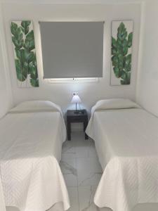 En eller flere senge i et værelse på Mareverde Vista mar - 2 Habitaciones