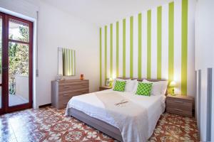 A bed or beds in a room at Baia Verde Beach & Fun Gallipoli - Lecce Selection