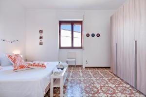 A bed or beds in a room at Baia Verde Beach & Fun Gallipoli - Lecce Selection