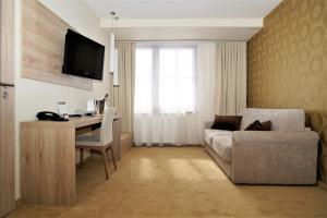 TV a/nebo společenská místnost v ubytování Grand Hotel BELLEVUE
