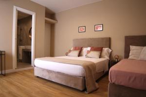 Postel nebo postele na pokoji v ubytování BeA Guest House