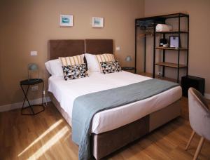 Postel nebo postele na pokoji v ubytování BeA Guest House