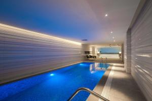 a swimming pool in the middle of a house at Aber Al Takhassusi in Riyadh