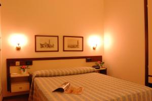 Posteľ alebo postele v izbe v ubytovaní Hotel San Marco