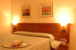 Posteľ alebo postele v izbe v ubytovaní Hotel San Marco