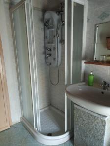 a bathroom with a shower and a sink at Il Càssero in Pomaretto +60 photos