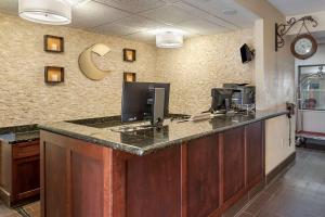 an office with a desk with a computer on it at Comfort Inn & Suites in Paw Paw
