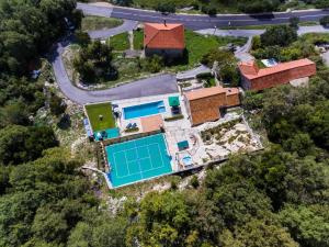 an aerial view of a house with a swimming pool at Villa Falcon Rook in Gruda