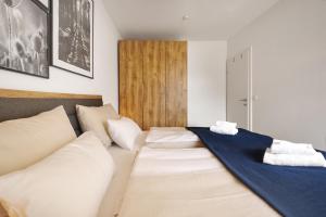 Postel nebo postele na pokoji v ubytování Adler Lodge D5